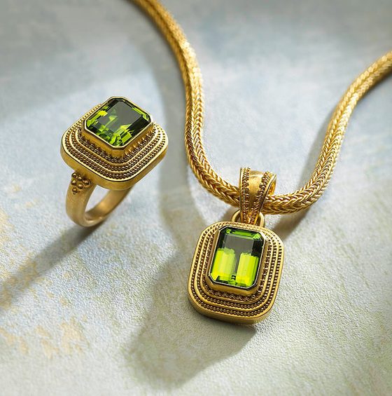 Gold ring and pendant set with green gemstones