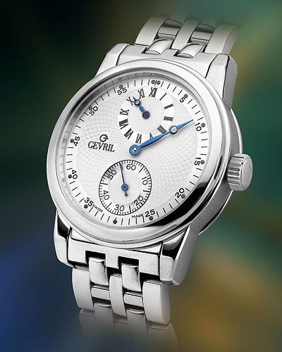 Stainless steel wristwatch on a pale background